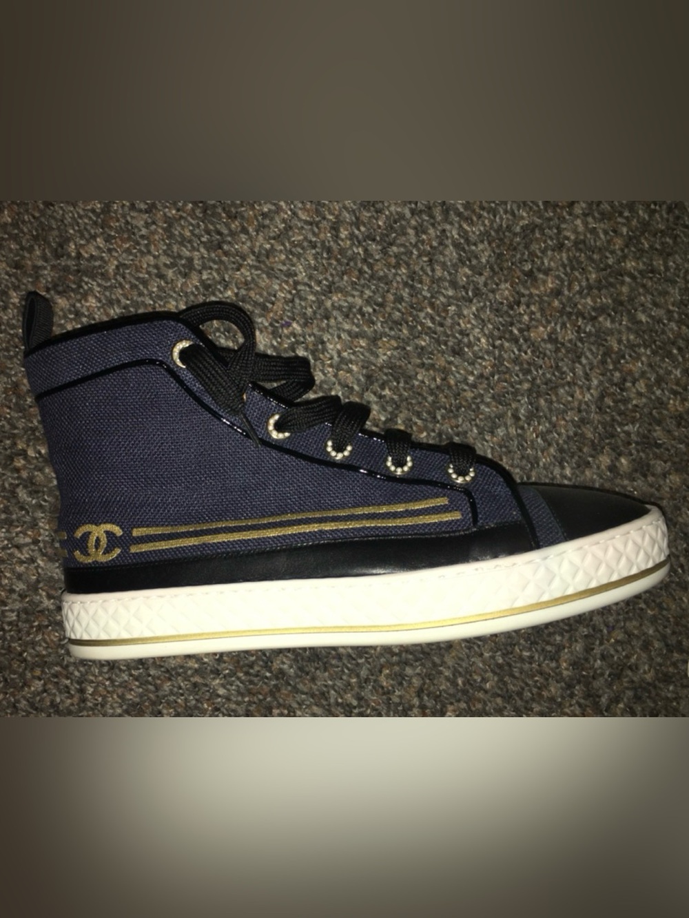 CHANEL Navy and White Slip-On Sneakers with Gold Accent